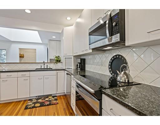 140 Cedar Street Lexington, MA 02421 - Photo 6 of 29 a kitchen with stainless steel appliances granite countertop a sink stove and cabinets