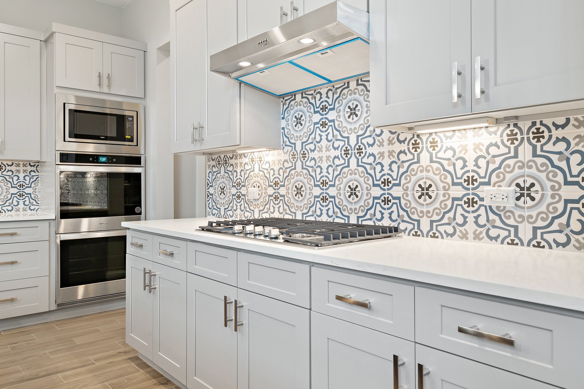 112 Axis Loop Georgetown, TX 78628 - Photo 12 of 39 a kitchen with white cabinets and stainless steel appliances