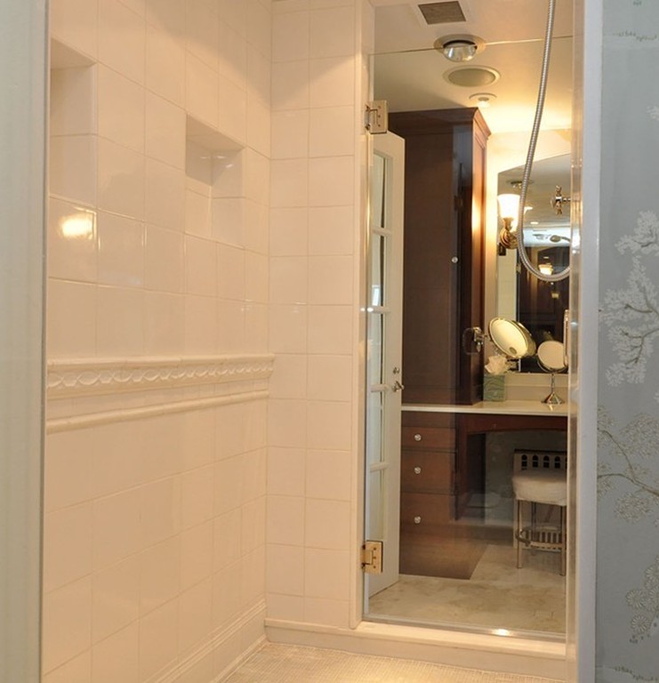 282 Beacon Street, Unit 7 Boston, MA 02116 - Photo 20 of 28 a bathroom with a glass shower door and a window