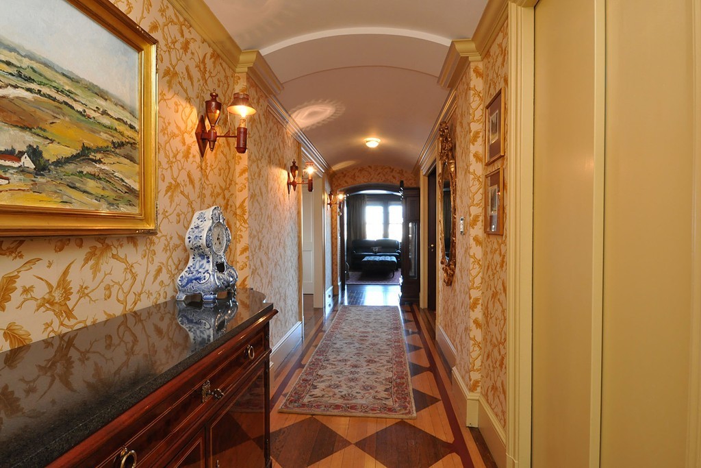 282 Beacon Street, Unit 7 Boston, MA 02116 - Photo 2 of 28 a hallway with kids room with wooden floor