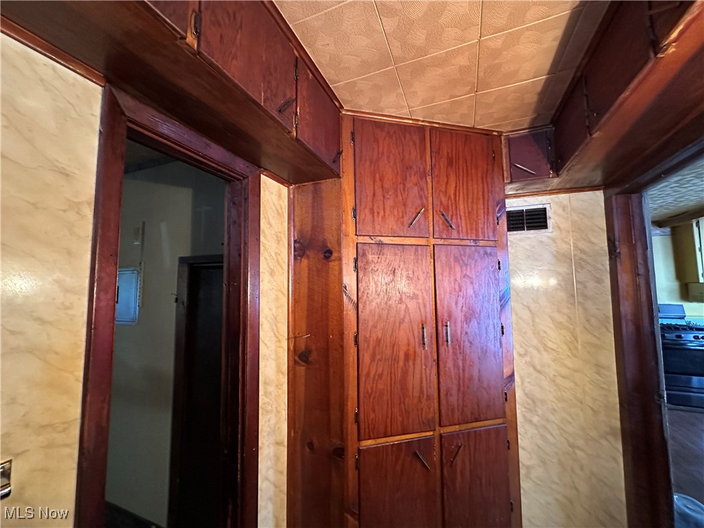 4058 Pardee Road Stow, OH 44224 - Photo 17 of 24 Room details featuring large linen closet and lots of storage cabinets along the ceiling