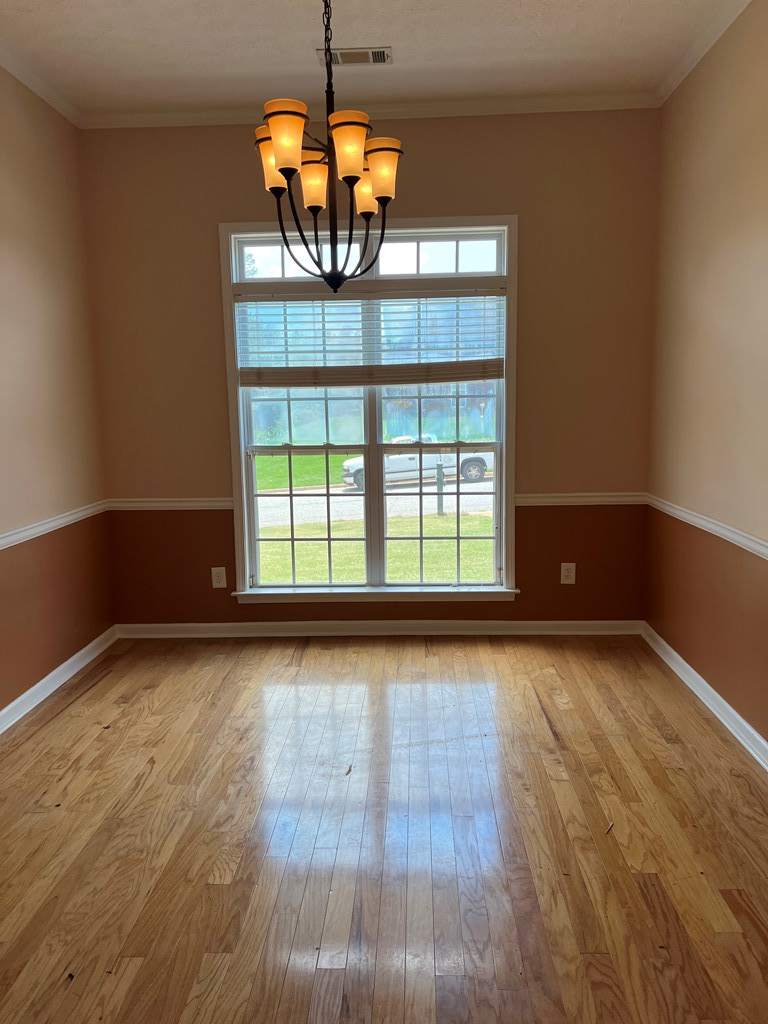 3003 Waterhill Drive Midland, GA 31820 - Photo 13 of 13 a view of a livingroom with a large window and wooden floor