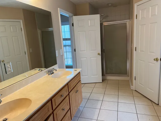 a room with a table and a refrigerator