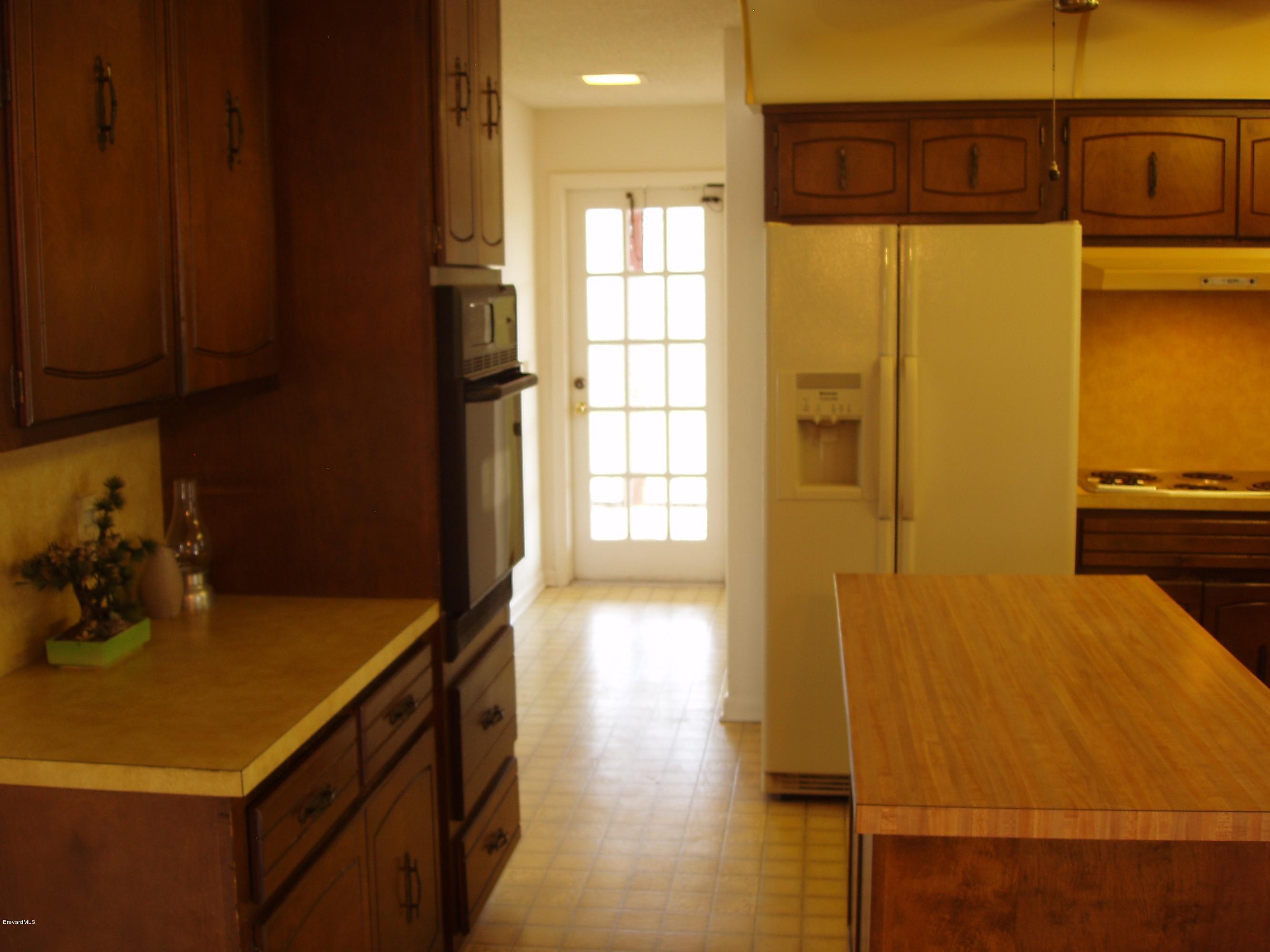 187 Sand Pine Road Indialantic, FL 32903 - Photo 11 of 29 Kitchen to Laundry & Porch