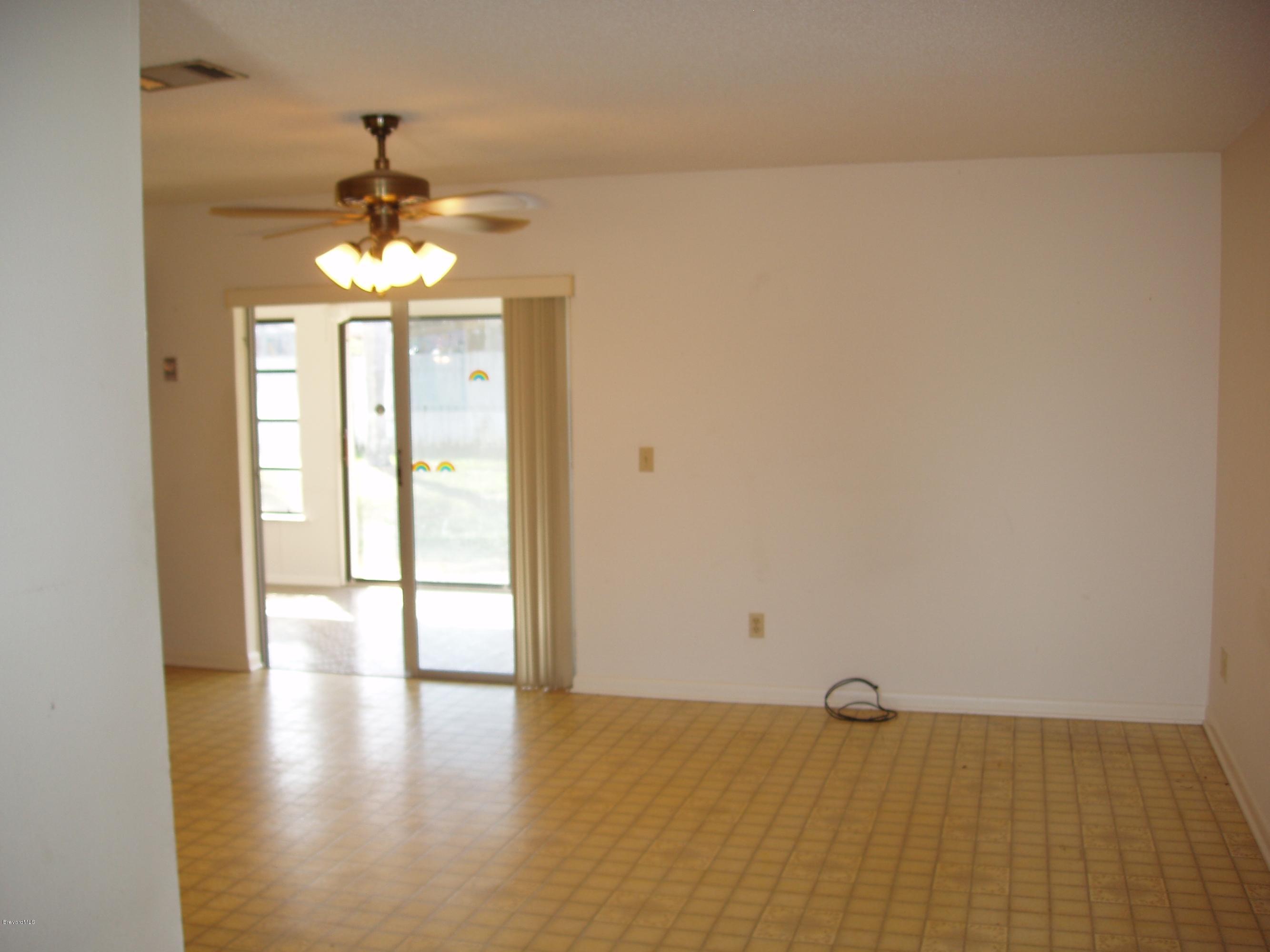 187 Sand Pine Road Indialantic, FL 32903 - Photo 14 of 29 Family Room to FLorida Room