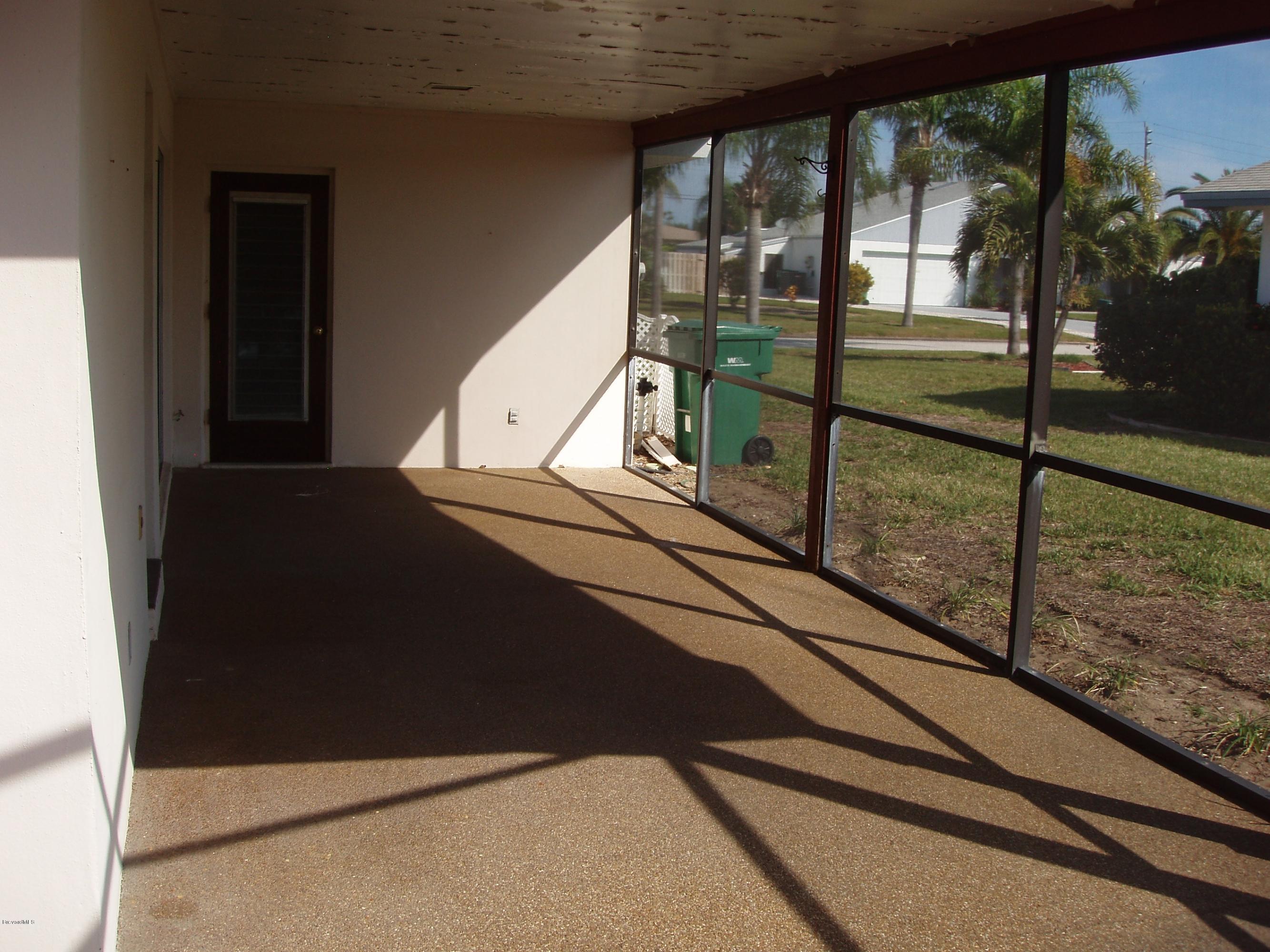 187 Sand Pine Road Indialantic, FL 32903 - Photo 25 of 29 Side Porch, Door to Garage