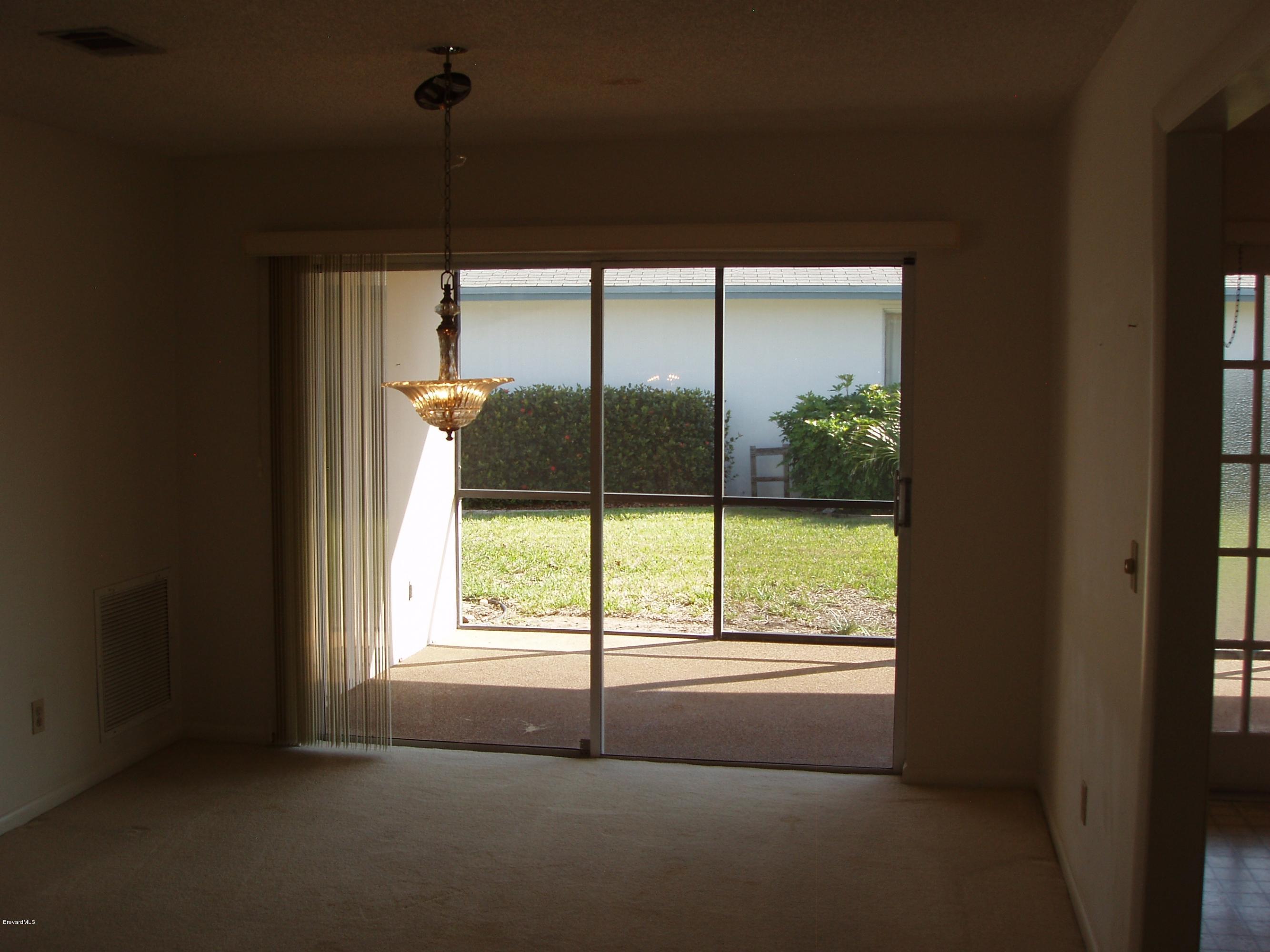 187 Sand Pine Road Indialantic, FL 32903 - Photo 6 of 29 Dining Room to Side Porch