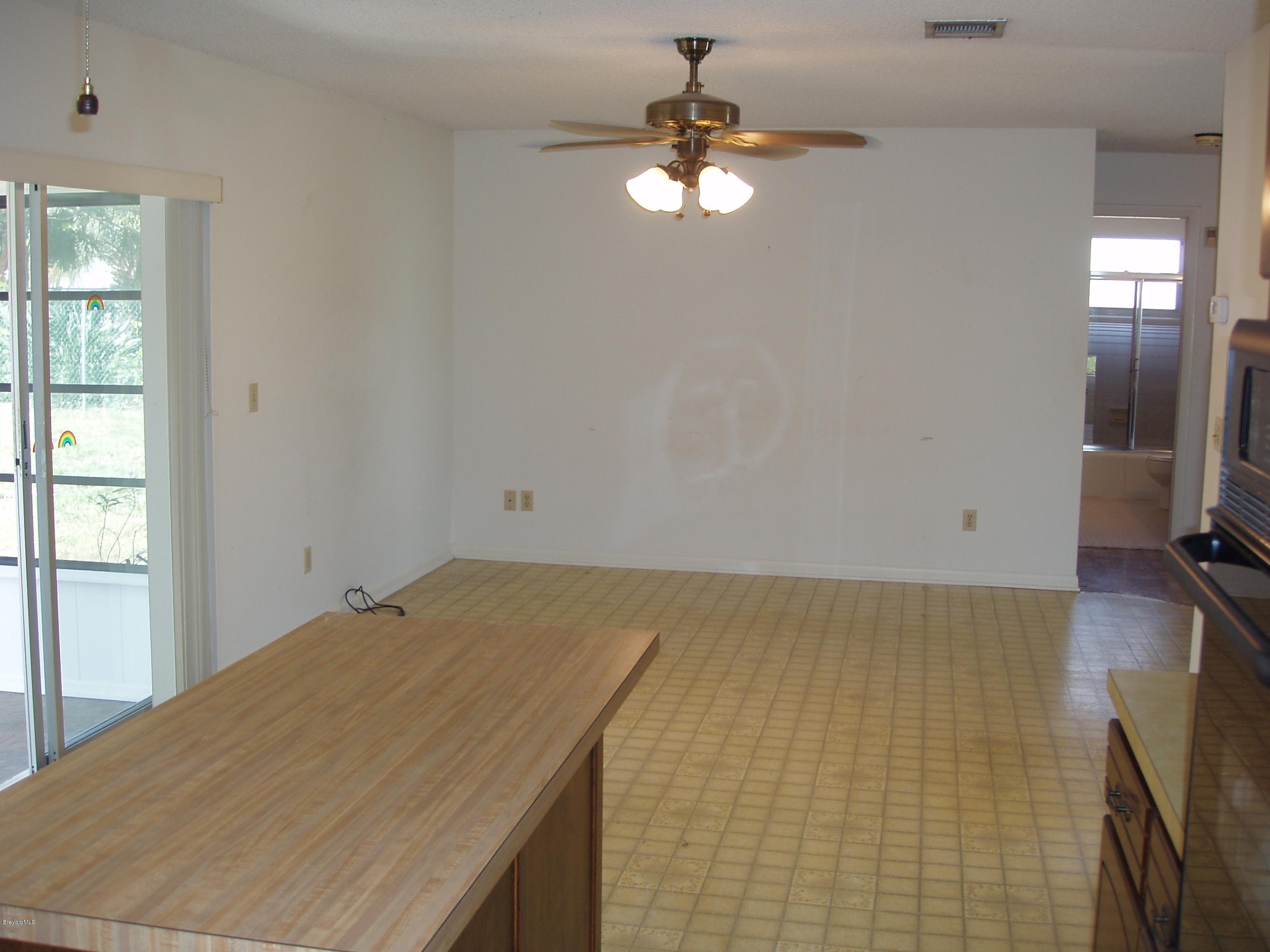 187 Sand Pine Road Indialantic, FL 32903 - Photo 8 of 29 Kitchen to Family Room