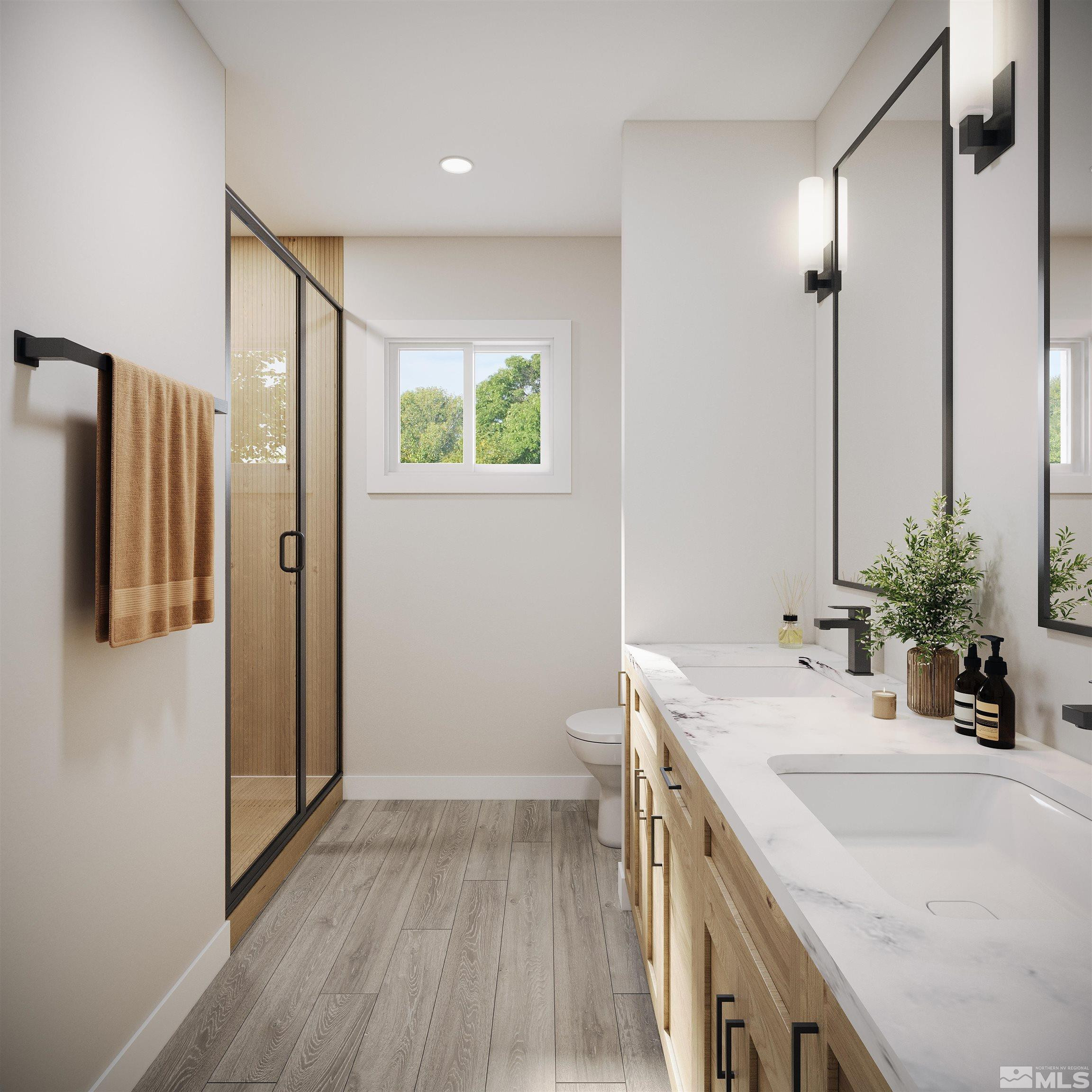 5267 Halter Way, Unit LOT 13 Winnemucca, NV 89445 - Photo 5 of 8 a bathroom with a sink a mirror and a shower