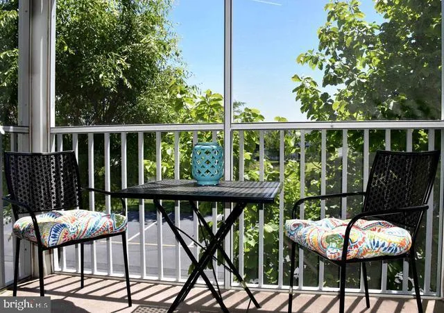 a view of a chairs and table in patio