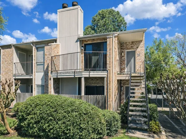 front view of a house with a small yard