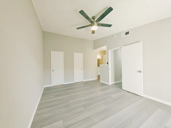 an empty room with wooden floor