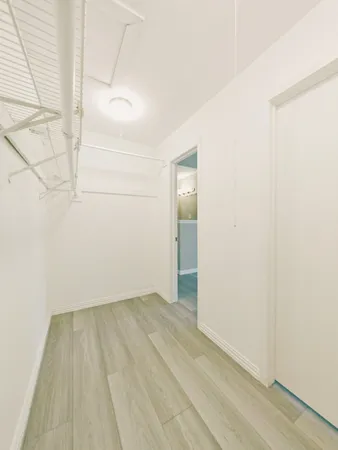 a bathroom with a sink vanity and mirror