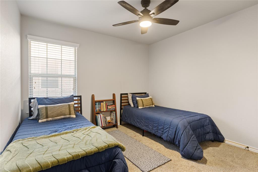 2565 Paddock Lane Robinson, TX 76706 - Photo 18 of 32 Carpeted bedroom featuring ceiling fan
