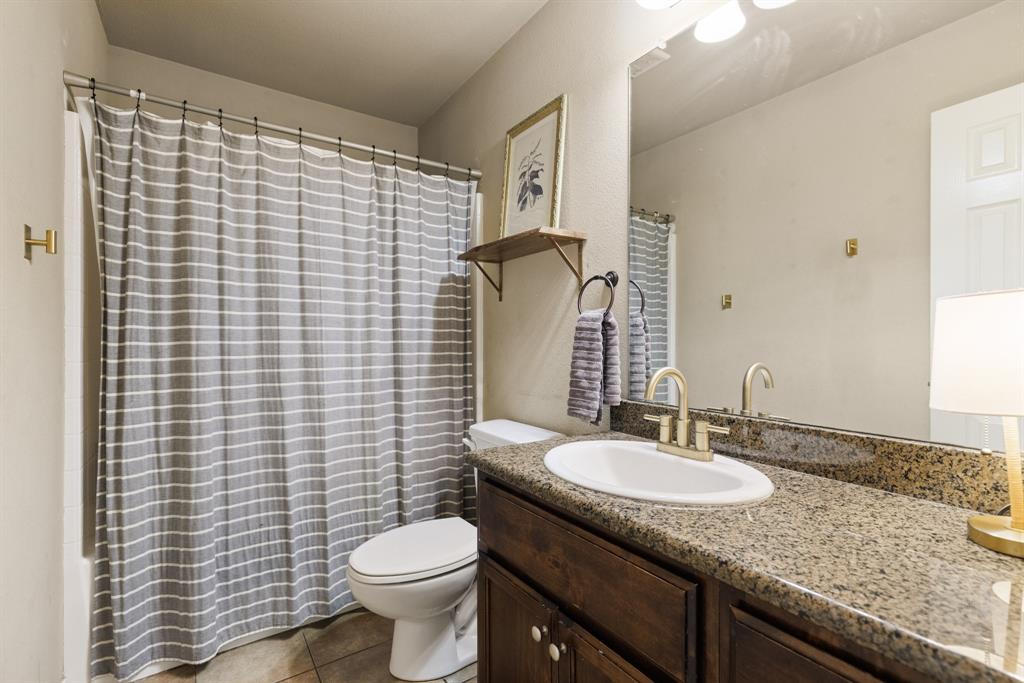 2565 Paddock Lane Robinson, TX 76706 - Photo 19 of 32 Bathroom with vanity and light tile patterned flooring