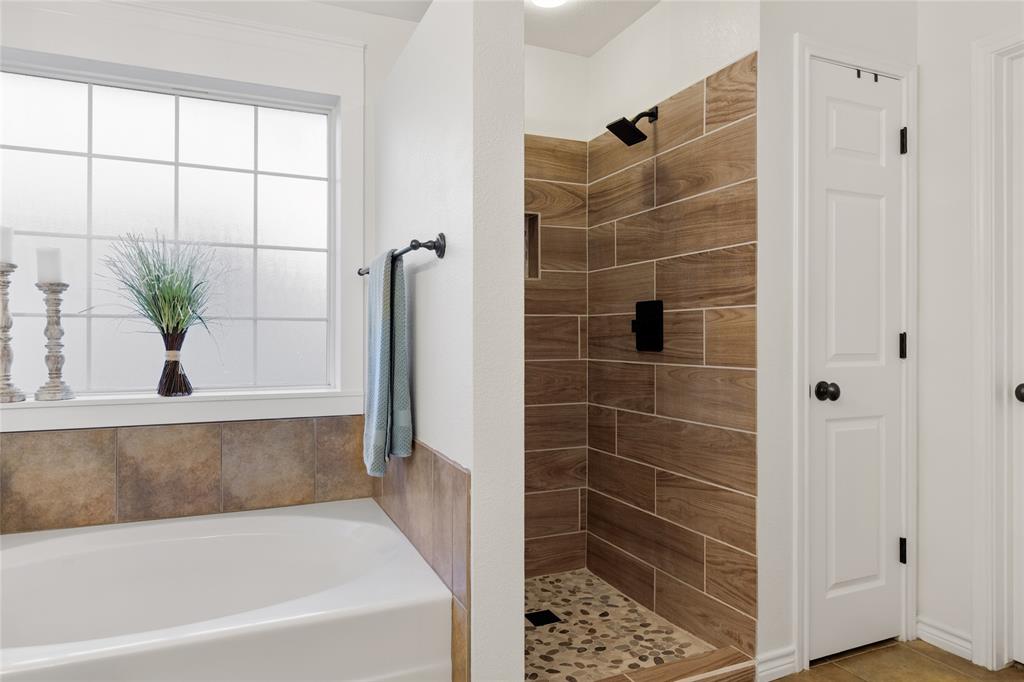 2565 Paddock Lane Robinson, TX 76706 - Photo 25 of 32 Bathroom featuring a bath and a stall shower