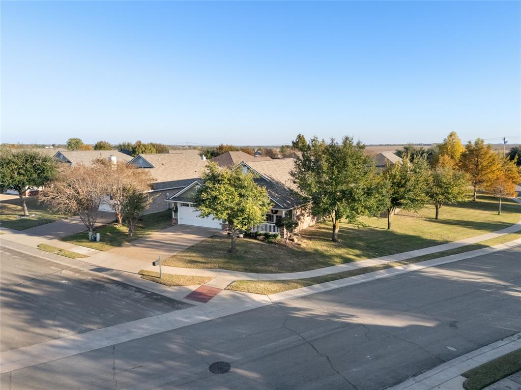 2565 Paddock Lane Robinson, TX 76706 - Photo 31 of 32 View of front of home with concrete driveway and a front yard