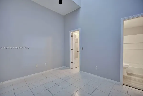 a view of an empty room and closet
