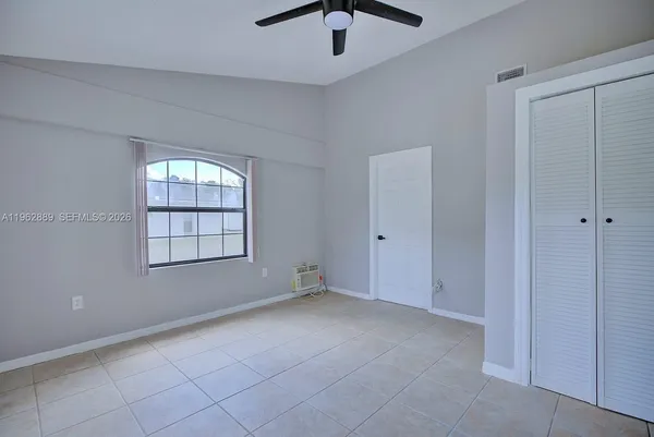 a view of an empty room with a window