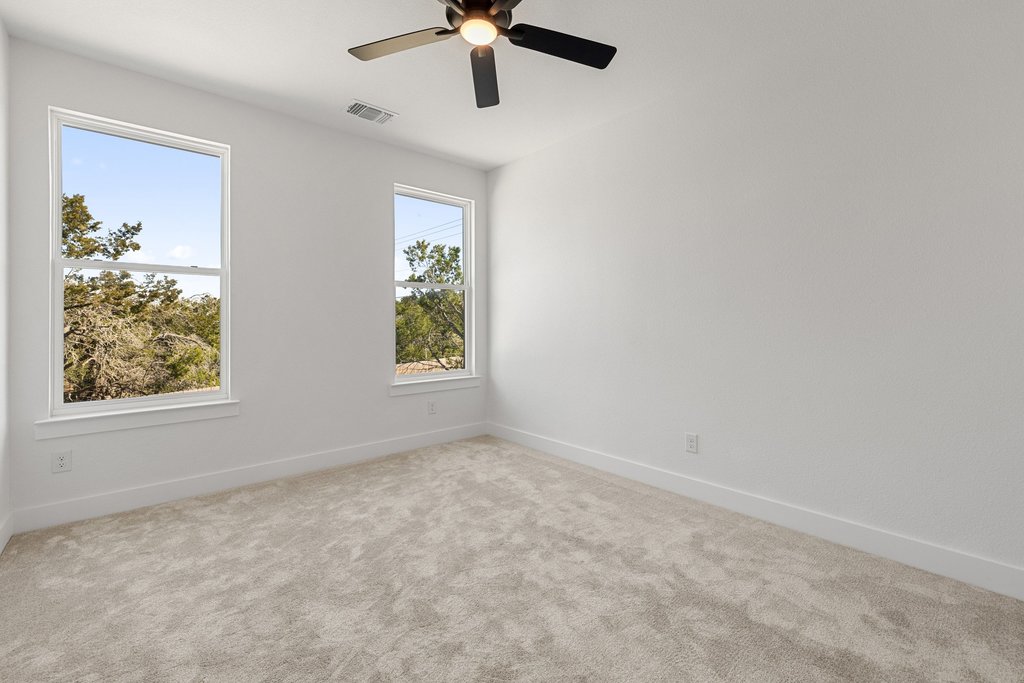 47 Peace Pipe Wimberley, TX 78676 - Photo 21 of 28 Spare room featuring carpet flooring and ceiling fan