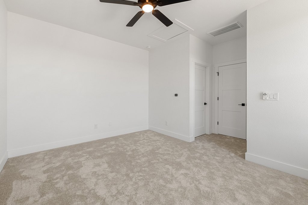 47 Peace Pipe Wimberley, TX 78676 - Photo 23 of 28 Empty room with light carpet and ceiling fan