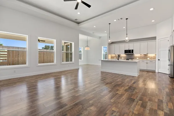 a view of a kitchen with microwave and cabinets