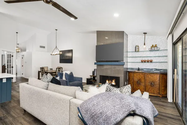 a living room with furniture and a fireplace