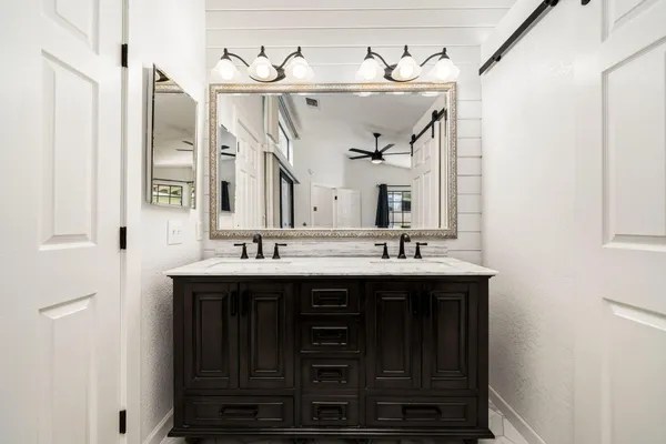 a bathroom with a sink and a mirror