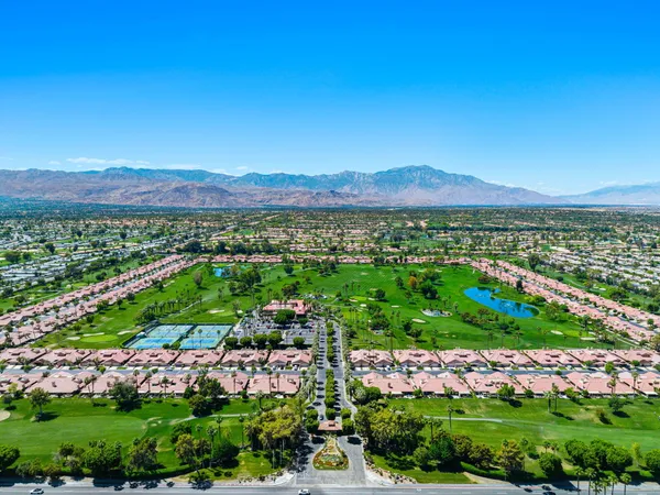 a view of a golf course with a house