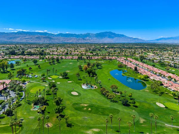 a front view of a house with large windows