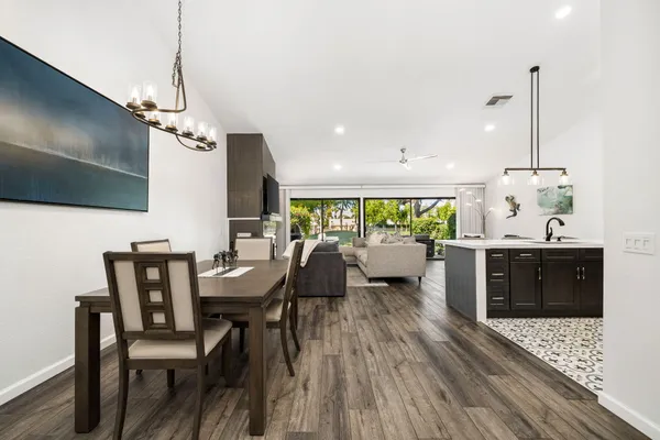 a view of a dining room with furniture window and wooden floor