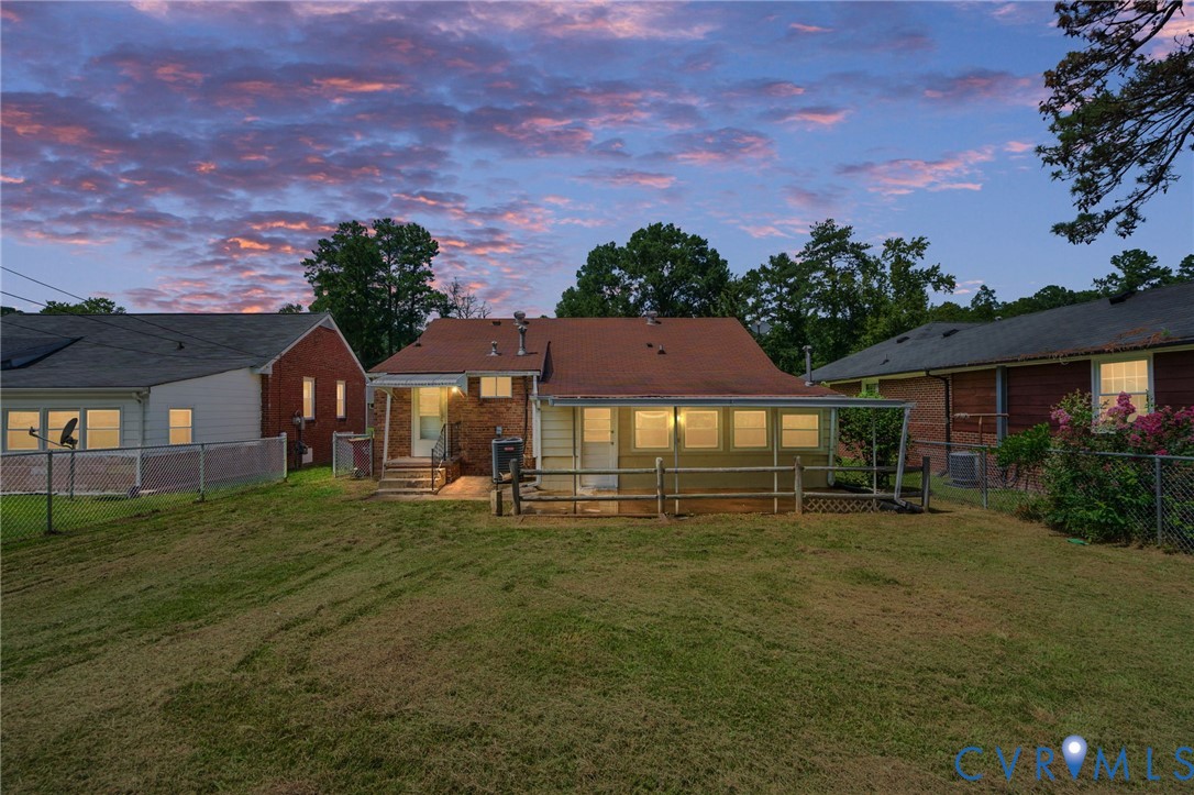 750 Hampton Road Petersburg, VA 23805 - Photo 33 of 33 Expansive grassy backyard with a chain-link fence