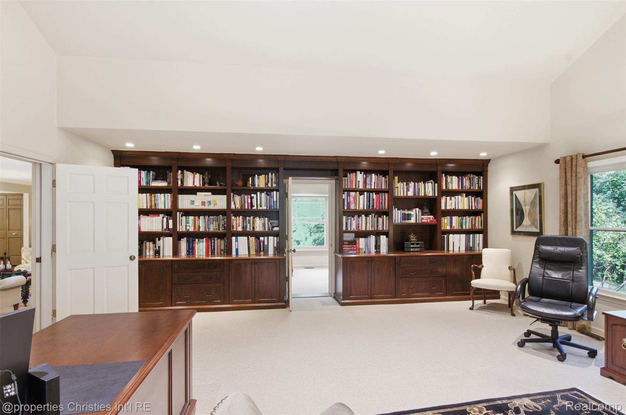 25235 Canterbury Road Franklin, MI 48025 - Photo 10 of 56 Wall of built in bookshelves and desk