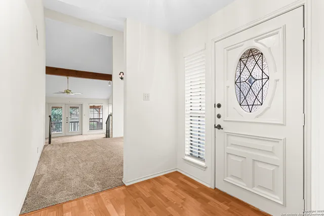 wooden floor in a hall with an entryway