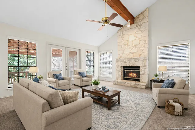 a living room with furniture and a fireplace