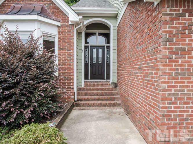 10128 Goodview Court Raleigh, NC 27613 - Photo 3 of 25 a view of front of a house with large windows