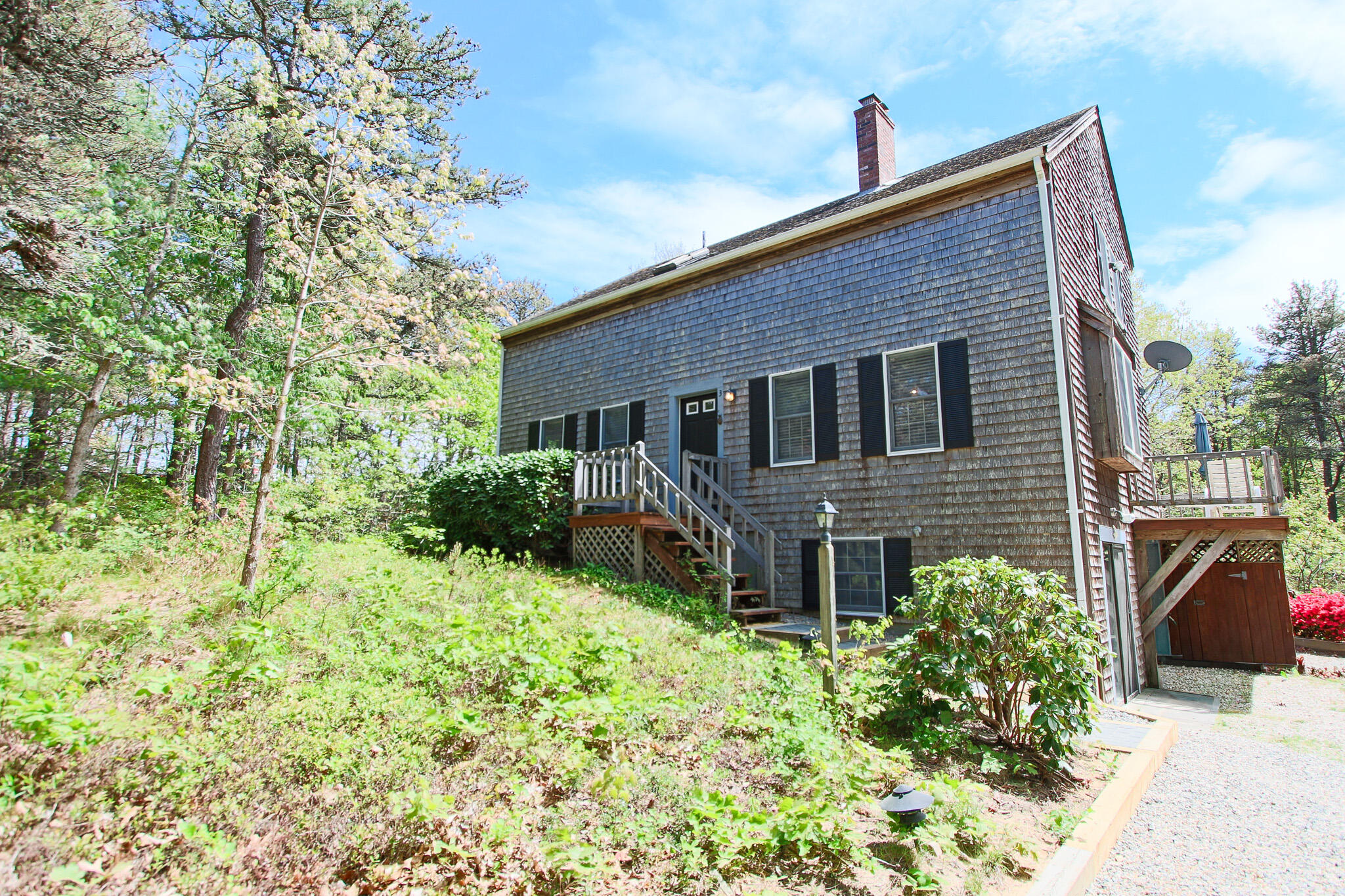 3 Bayberry Lane Truro, MA 02666 - Photo 1 of 18 a front view of a house with garden