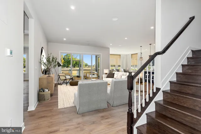 a view of living room with furniture and wooden floor