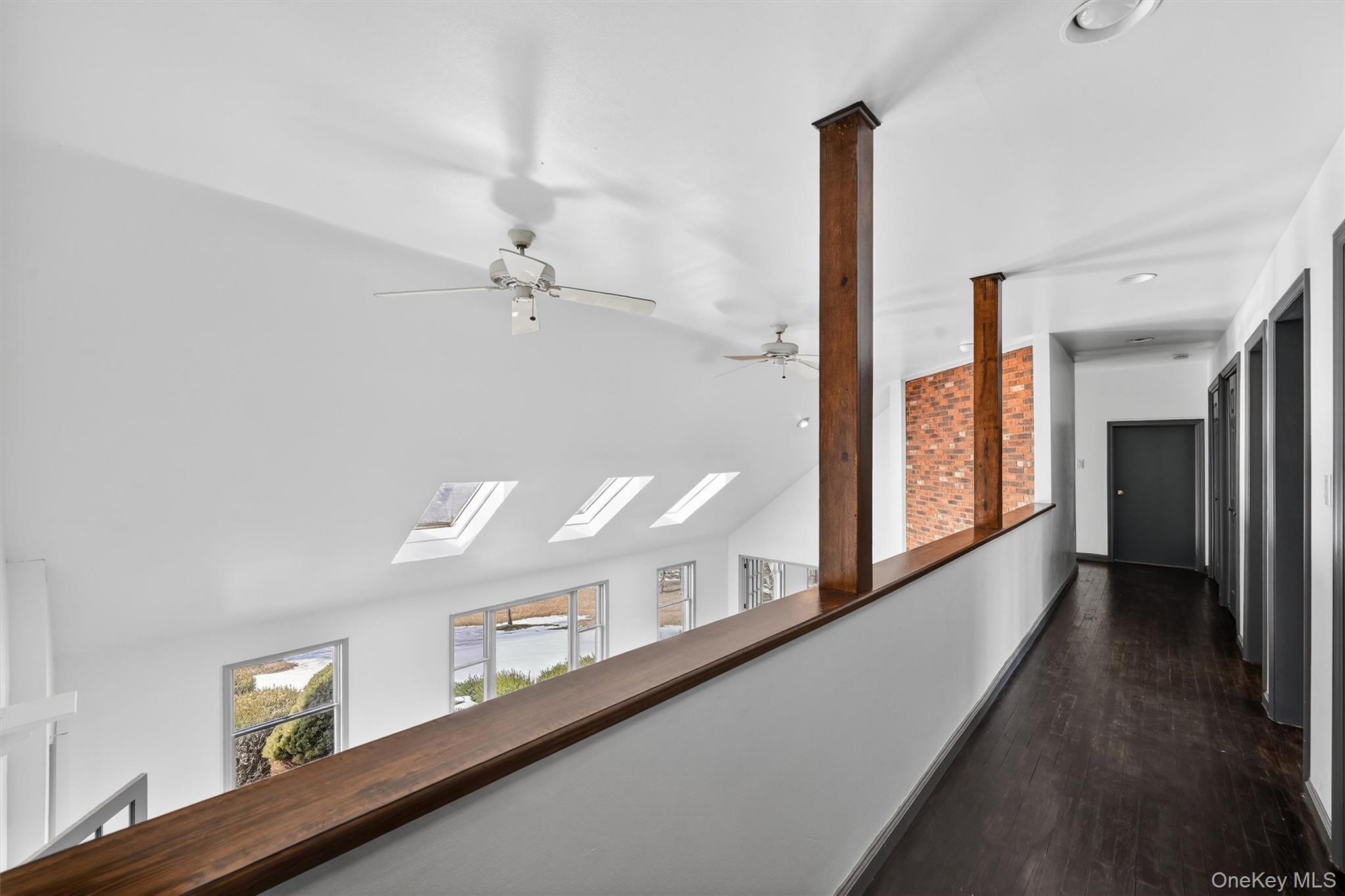 285 Hill Road Goshen, NY 10924 - Photo 20 of 49 Open to the living room below, the second level hallway has a modern vibe