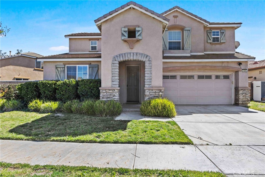 1200 Dutch Mill Road Hemet, CA 92545 - Photo 1 of 1 a front view of a house with garden