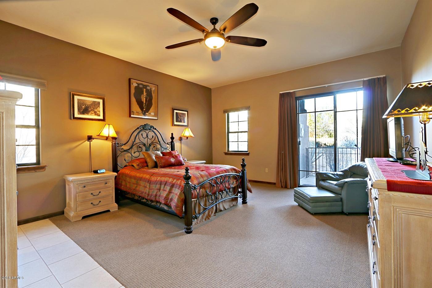 36601 North Mule Train Road, Unit 8A Carefree, AZ 85377 - Photo 13 of 50 a bedroom with a bed and a couch