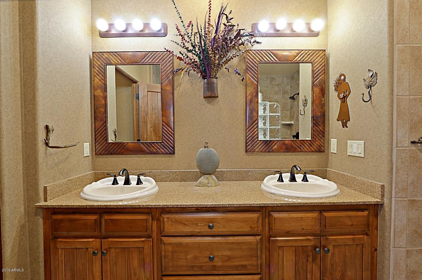 36601 North Mule Train Road, Unit 8A Carefree, AZ 85377 - Photo 15 of 50 a bathroom with a sink and a mirror