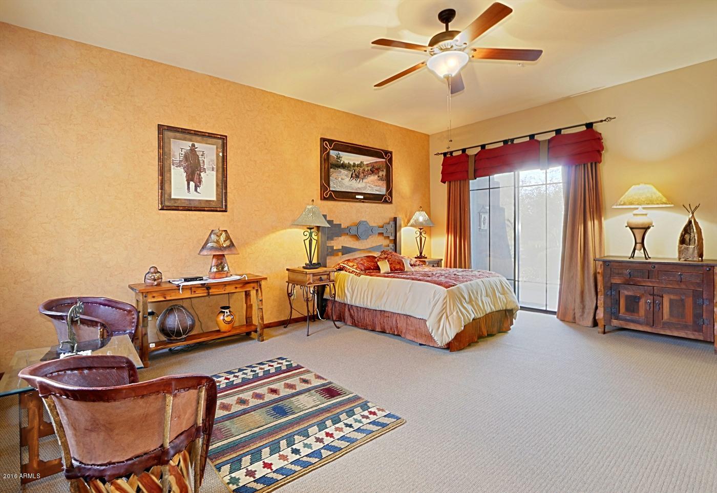 36601 North Mule Train Road, Unit 8A Carefree, AZ 85377 - Photo 20 of 50 a bedroom with furniture and wooden floor