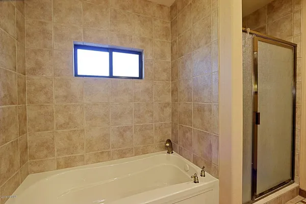 a bath tub sitting next to a window