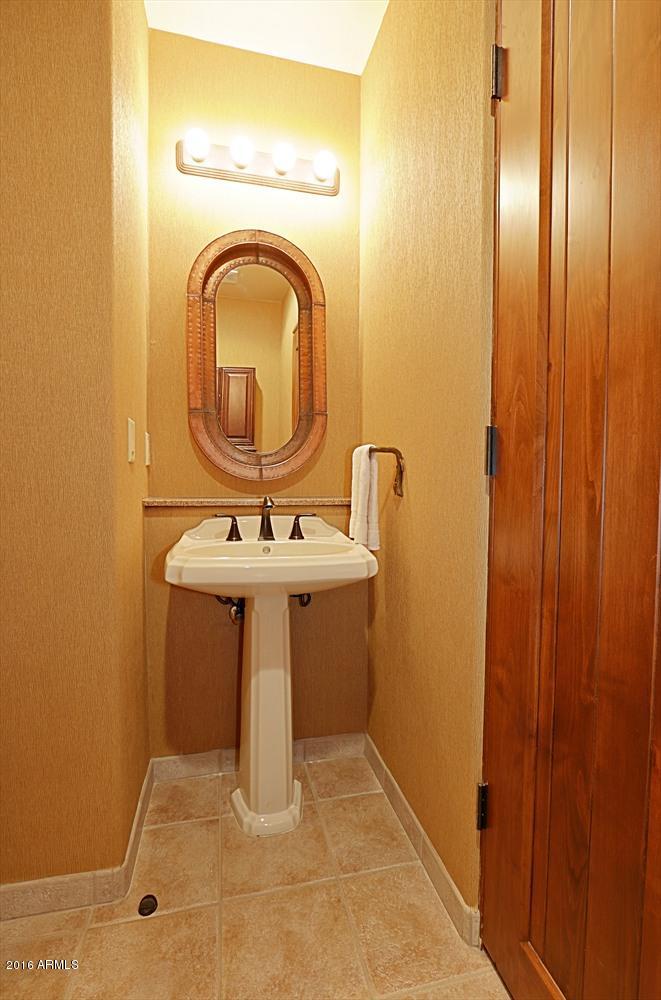 36601 North Mule Train Road, Unit 8A Carefree, AZ 85377 - Photo 26 of 50 a bathroom with a sink a mirror and a window