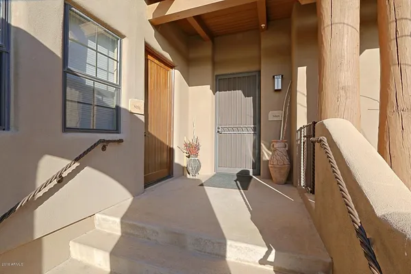 a view of a kitchen with furniture and a window