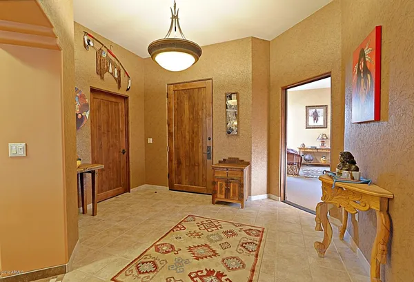 a bedroom with furniture and a rug