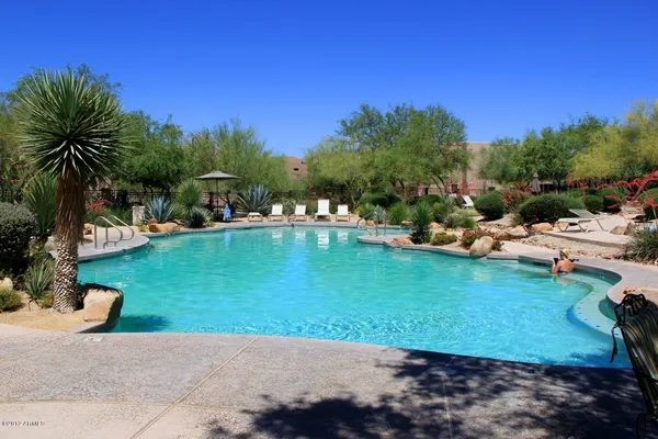 a view of swimming pool from a balcony