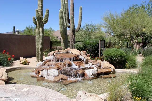 a view of a golf course with a tree