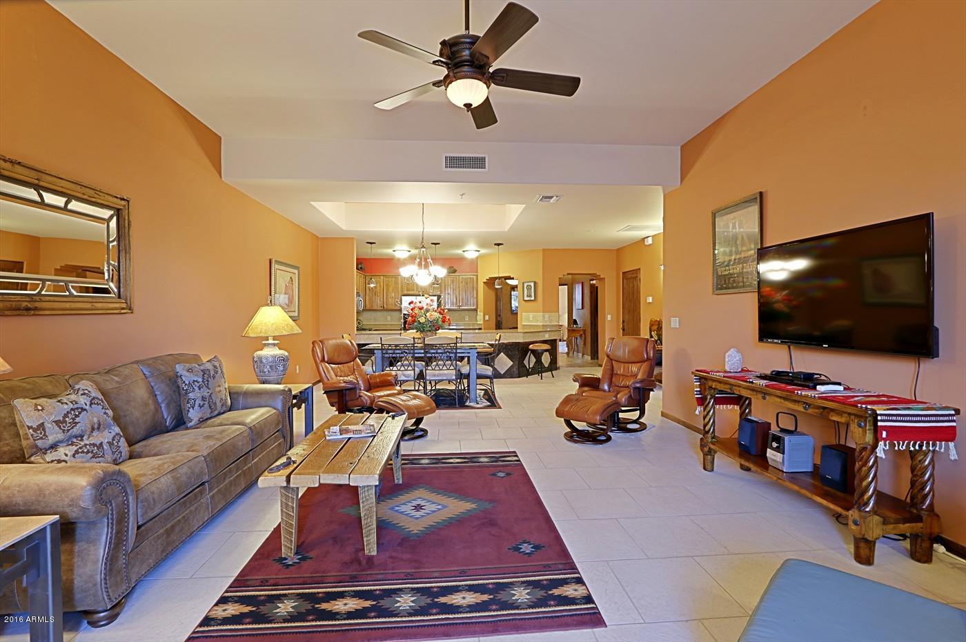 36601 North Mule Train Road, Unit 8A Carefree, AZ 85377 - Photo 6 of 50 a living room with furniture and a flat screen tv